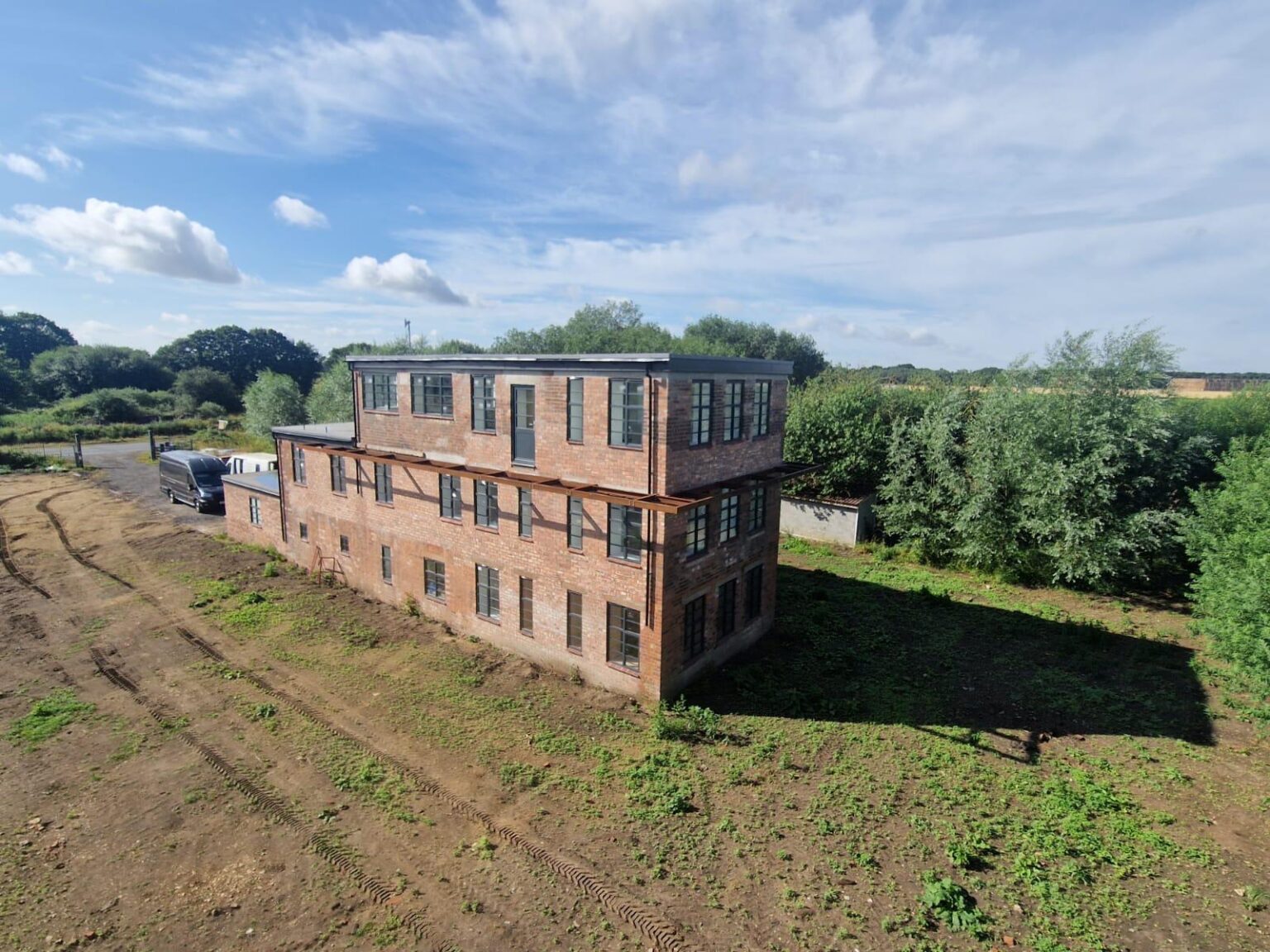 Large brick building structure in rural Lincolnshire, completed with professional on site welding by Lincolnshire Site Weld and Fabrication